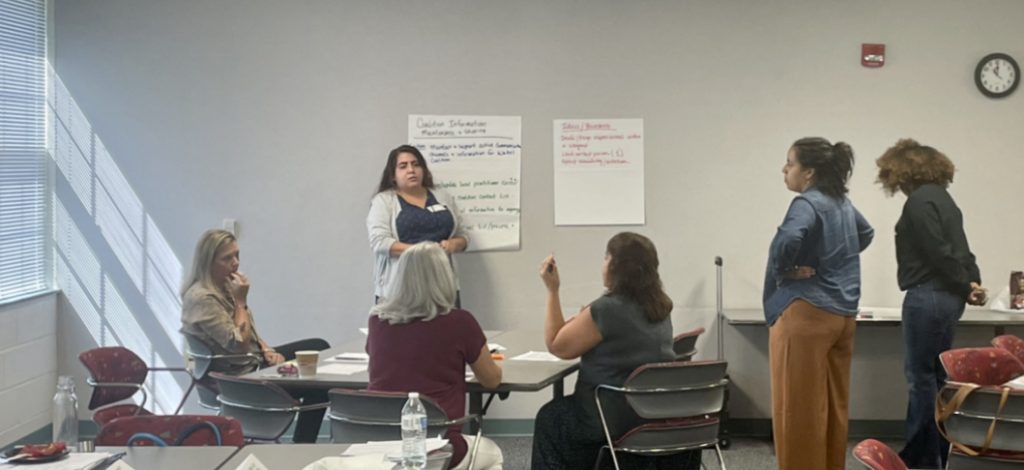 A group of women engaged in discussion.